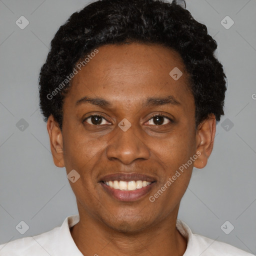 Joyful black young-adult female with short  black hair and brown eyes