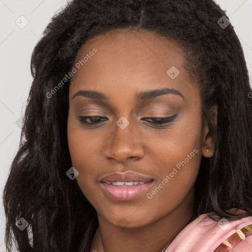 Joyful black young-adult female with long  brown hair and brown eyes