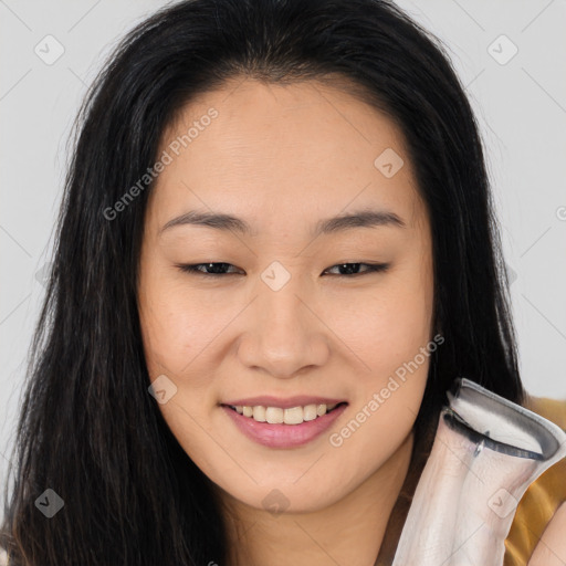 Joyful asian young-adult female with long  brown hair and brown eyes