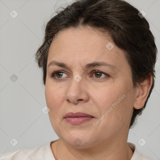 Joyful white adult female with short  brown hair and brown eyes