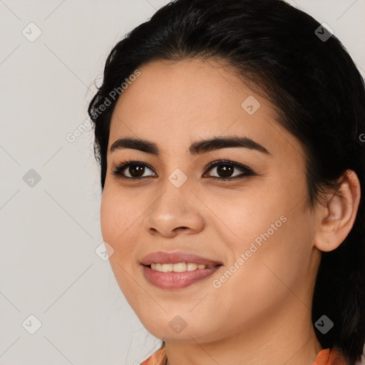 Joyful asian young-adult female with medium  black hair and brown eyes