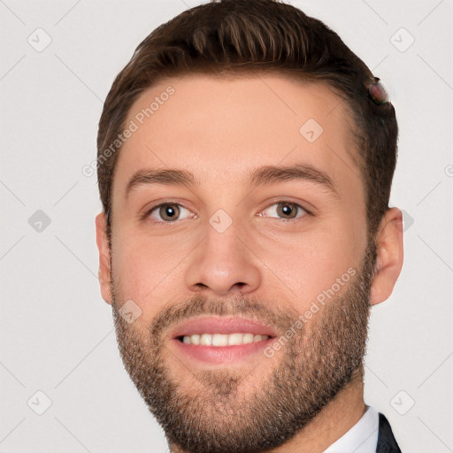 Joyful white young-adult male with short  brown hair and grey eyes