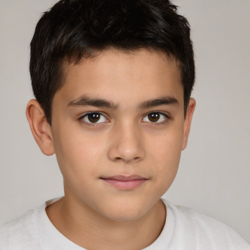 Joyful white child male with short  brown hair and brown eyes