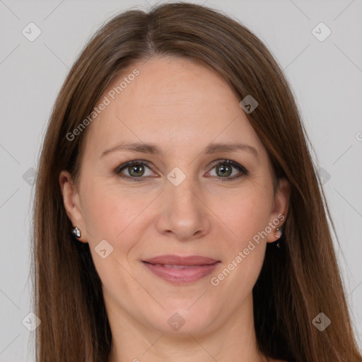 Joyful white adult female with long  brown hair and grey eyes