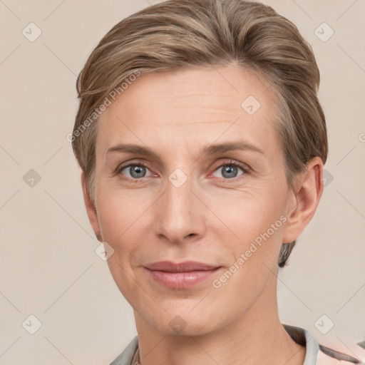 Joyful white adult female with short  brown hair and grey eyes