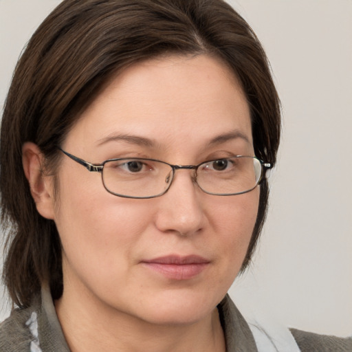 Neutral white adult female with medium  brown hair and grey eyes