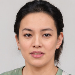 Joyful white young-adult female with medium  brown hair and brown eyes