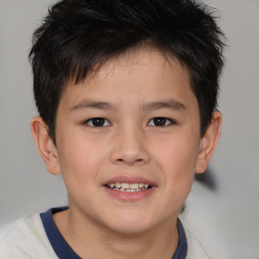 Joyful white child male with short  brown hair and brown eyes