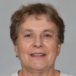 Joyful white middle-aged male with short  brown hair and brown eyes