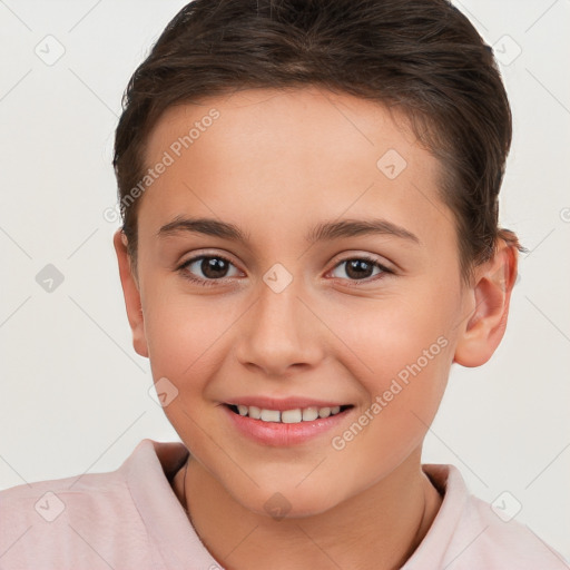 Joyful white child female with short  brown hair and brown eyes