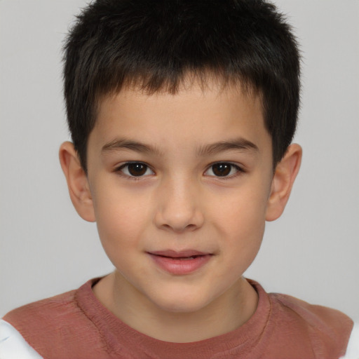 Joyful white child male with short  brown hair and brown eyes