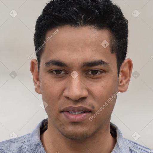 Joyful white young-adult male with short  black hair and brown eyes