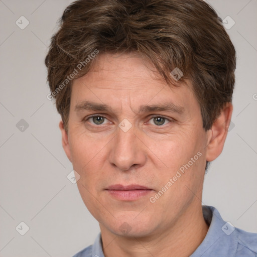 Joyful white adult male with short  brown hair and grey eyes