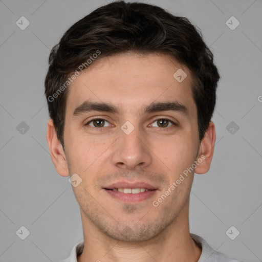 Joyful white young-adult male with short  brown hair and brown eyes