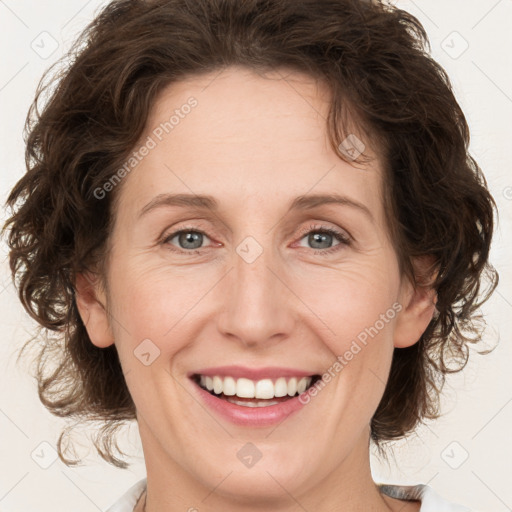 Joyful white young-adult female with medium  brown hair and green eyes