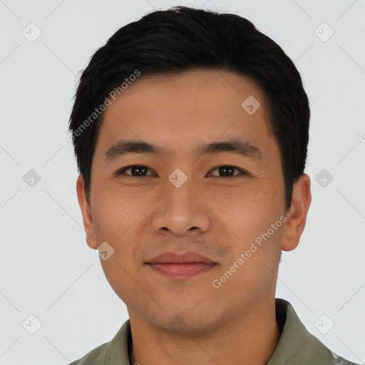 Joyful asian young-adult male with short  black hair and brown eyes