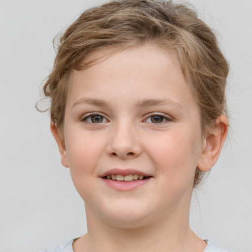 Joyful white child female with short  brown hair and grey eyes