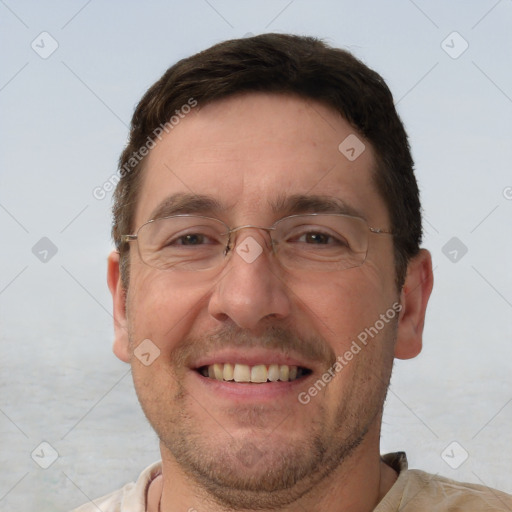 Joyful white adult male with short  brown hair and brown eyes