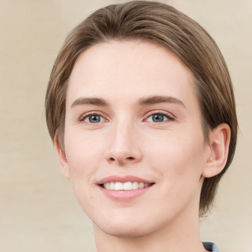 Joyful white young-adult female with medium  brown hair and green eyes