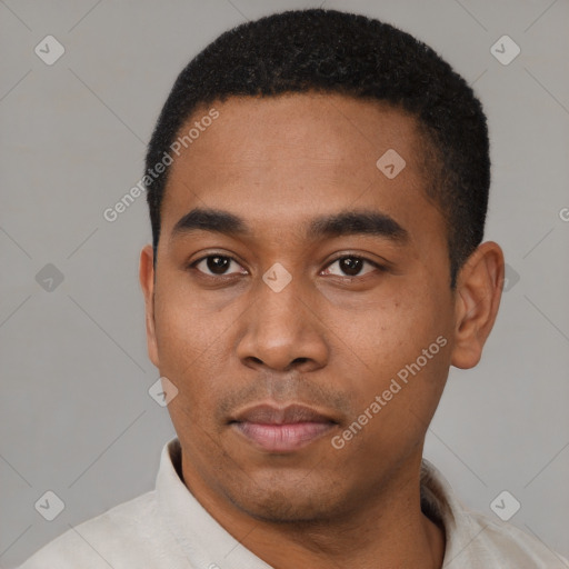 Neutral latino young-adult male with short  black hair and brown eyes