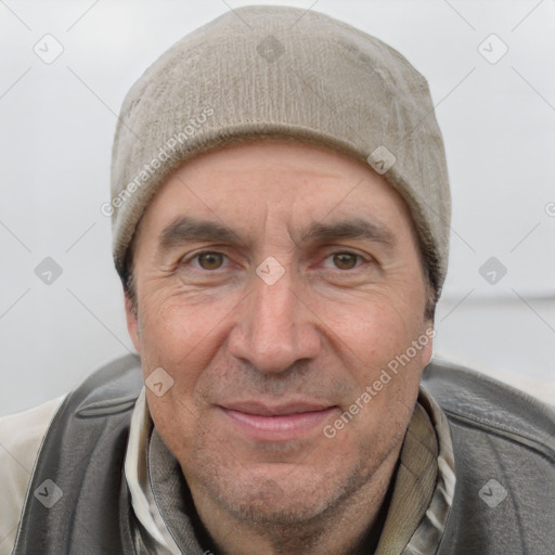 Joyful white adult male with short  black hair and brown eyes