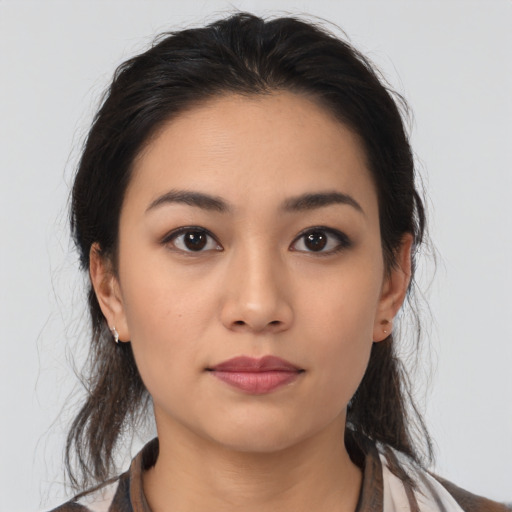 Neutral latino young-adult female with medium  brown hair and brown eyes