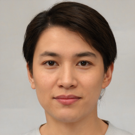 Joyful white young-adult female with medium  brown hair and brown eyes
