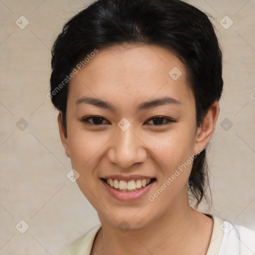 Joyful asian young-adult female with short  black hair and brown eyes