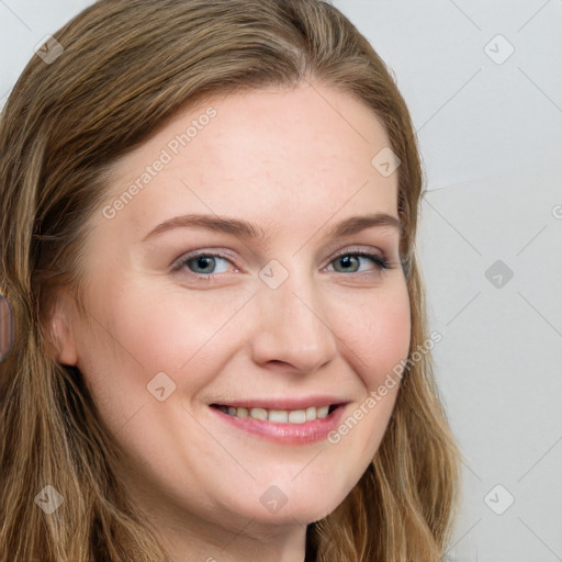 Joyful white young-adult female with long  brown hair and blue eyes