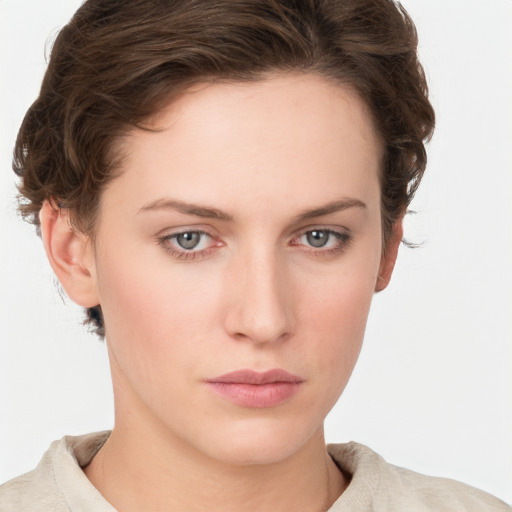 Neutral white young-adult female with short  brown hair and grey eyes