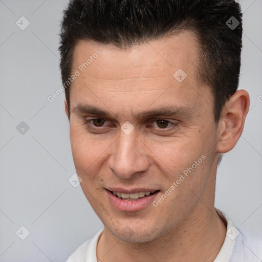 Joyful white young-adult male with short  brown hair and brown eyes