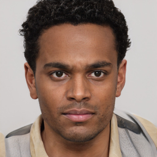 Neutral black young-adult male with short  brown hair and brown eyes