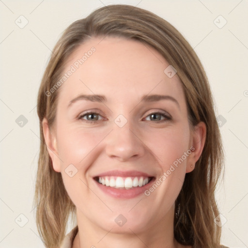 Joyful white young-adult female with long  brown hair and grey eyes