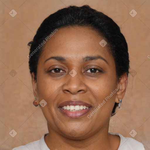 Joyful latino adult female with short  brown hair and brown eyes