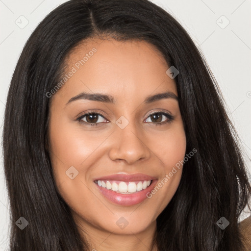 Joyful latino young-adult female with long  brown hair and brown eyes