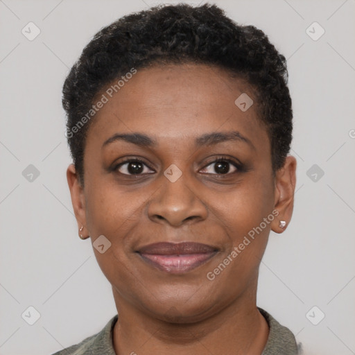 Joyful black young-adult female with short  black hair and brown eyes