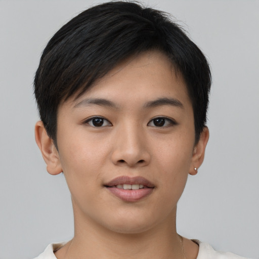 Joyful asian young-adult female with short  brown hair and brown eyes