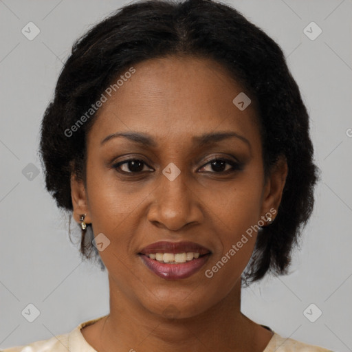 Joyful black adult female with short  brown hair and brown eyes