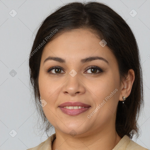 Joyful latino young-adult female with medium  brown hair and brown eyes