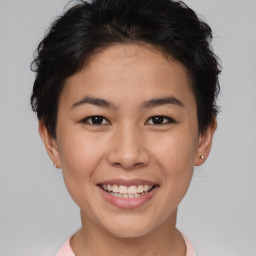 Joyful asian young-adult female with short  brown hair and brown eyes