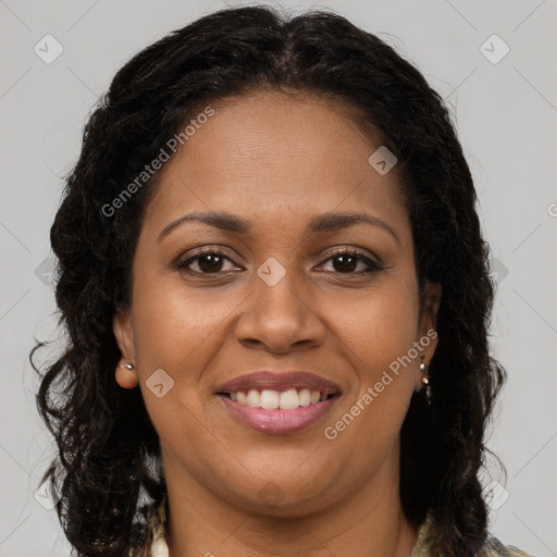 Joyful black young-adult female with long  brown hair and brown eyes