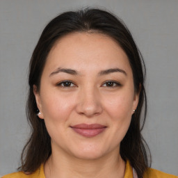 Joyful white young-adult female with medium  brown hair and brown eyes