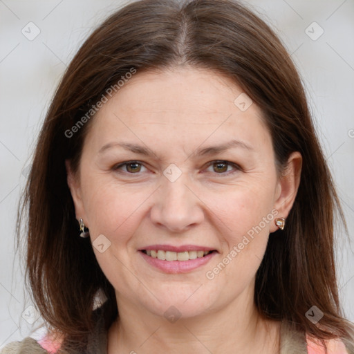 Joyful white adult female with medium  brown hair and grey eyes