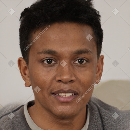 Joyful black young-adult male with short  brown hair and brown eyes