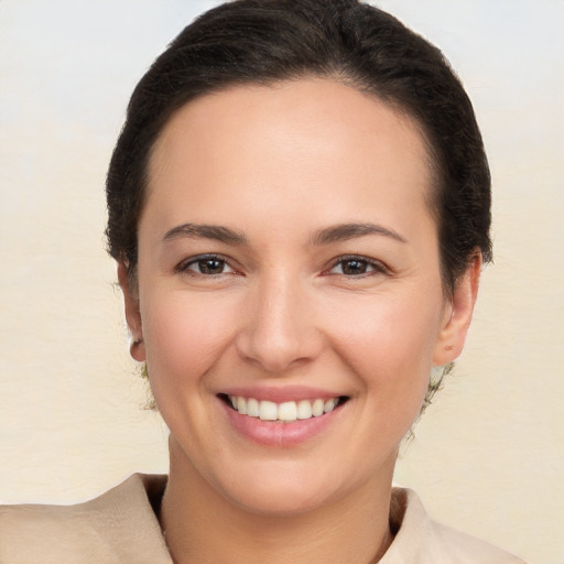 Joyful white young-adult female with short  brown hair and brown eyes