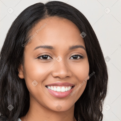 Joyful latino young-adult female with long  black hair and brown eyes