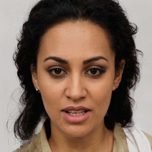 Joyful latino young-adult female with medium  brown hair and brown eyes