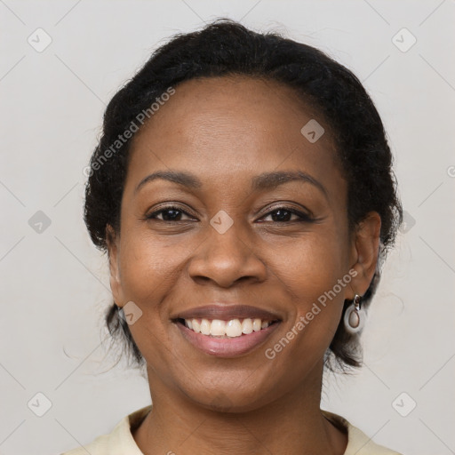 Joyful black young-adult female with medium  brown hair and brown eyes