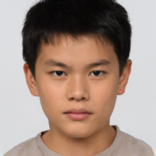 Neutral asian child male with short  brown hair and brown eyes