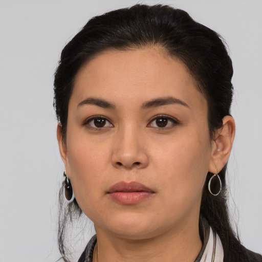 Neutral latino young-adult female with medium  black hair and brown eyes